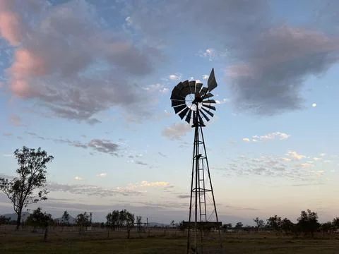 Wind pump turning at sunset outback Australia Stock Photos