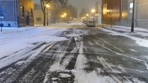 Wind pushing the snow on the road Stock Footage 125550871