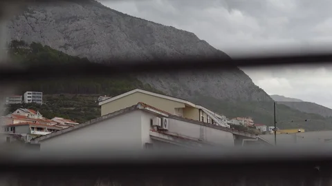 Wind from the rain storm the view from the Windows of the house. Makarska Stock Footage 99532429