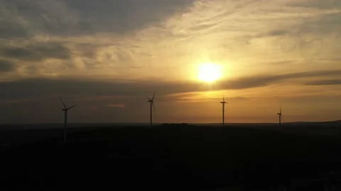 Wind roses that generate energy at sunset Stock Footage 148499797