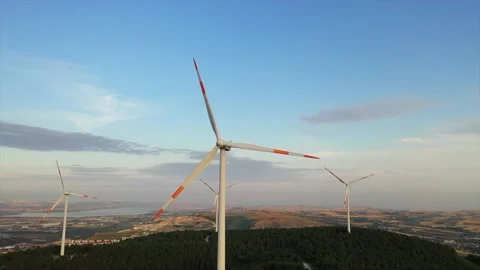 Wind roses that generate energy at sunset Stock Footage 148523067