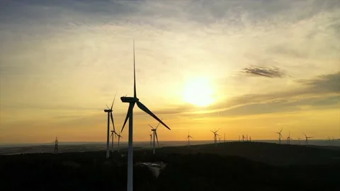 Wind roses that generate energy at sunset Stock Footage 148523997