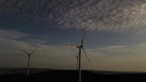 Wind roses that generate energy at sunset Stock Footage 148524754