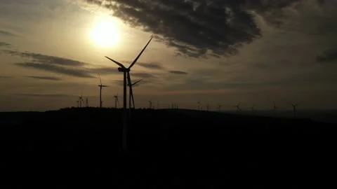 Wind roses that generate energy at sunset Stock Footage 148525817