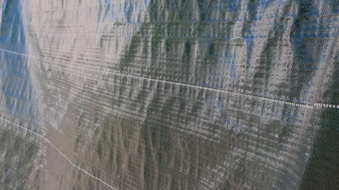 The wind shakes the hanging tarp Video stock 128635461