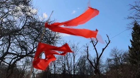 The wind shakes the red ribbon Stock Footage 128639403