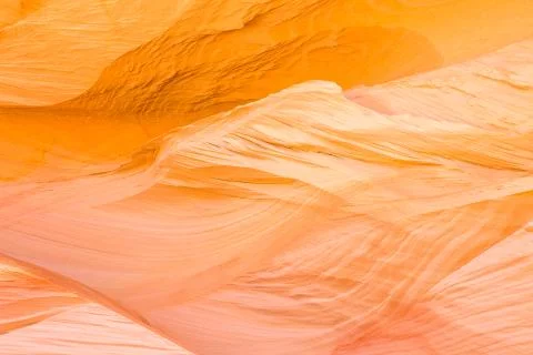 Wind shaped layers of soft sandstone in waves and layers. Stock Photos