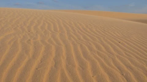Wind-shaped sand dunes under soft evening light on Socotra Island, POV walking Stock-Footage 339282324