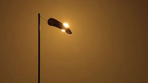 Wind sock air sleeve moving in the wind on sunset Stock Footage 65487202