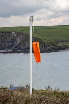 A wind sock on a calm day, on the Devon coast Stock Photos