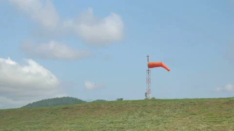 Wind sock fly on hill and cloud in the blue sky is background. Stock Footage 155054559