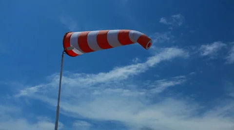 Wind sock - red and white pointer strength and direction of the wind Stock Footage 7045988
