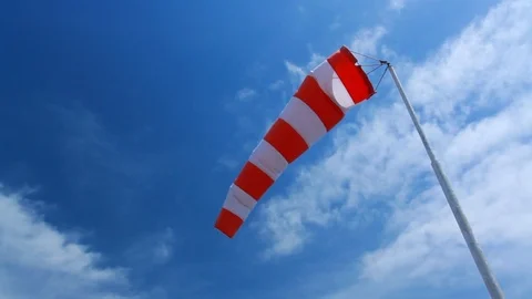 Wind sock - red and white pointer strength and direction of the wind Stock Footage 92215067