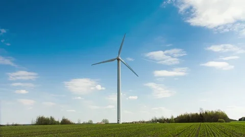 Wind stations are spinning against the beautiful blue sky. Stock Footage 75627850