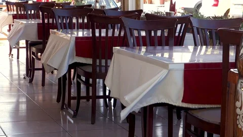 Wind stirs tablecloths in summer cafe Stock Footage 106797417