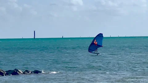 Wind surfer in Miami Key Biscayne Beach Stock Footage 220238472