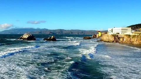 Wind surfer riding waves on San Francisco by Aerial Drone Stock Footage 70399005
