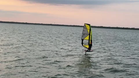 Wind Surfing During Sunset Stock Footage 245224195