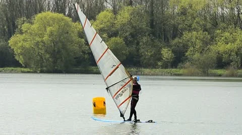 Wind surfing on a lake Stock Footage 10898874