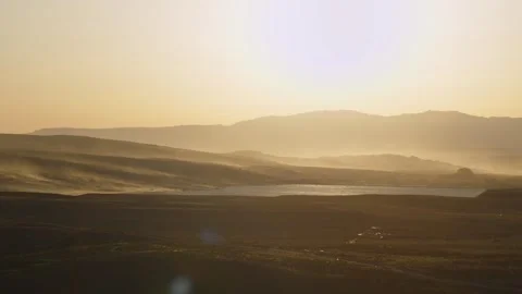 The wind sweeps the sand from the dunes and hills at sunset, Hurricane, US Stock Footage 287732792