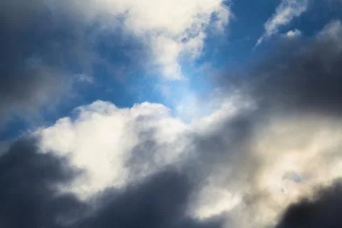 The wind tore the clouds in the sky, a gap through the clouds Stock Photos