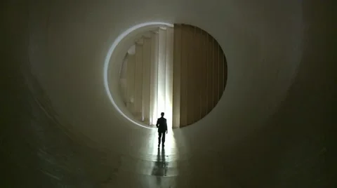 Wind Tunnel With Person Walking Away From Camera Stock Footage