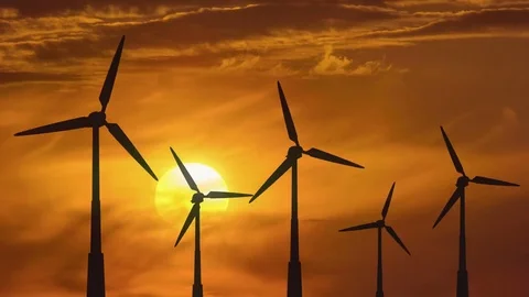 The wind turbine against the background of sunset Stock Footage 74585596