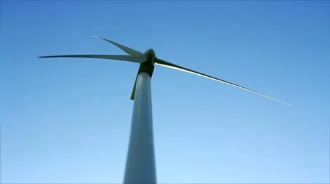 Wind turbine against blue sky Stock Footage