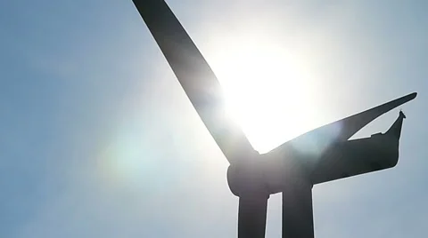 Wind turbine against cloudy blue sky background Stock Footage 45443896