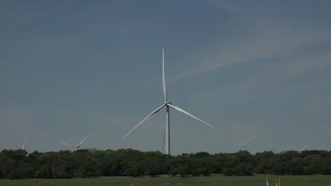 Wind turbine against cloudy evening sky at sunset, 4K. Stock Footage 241546146