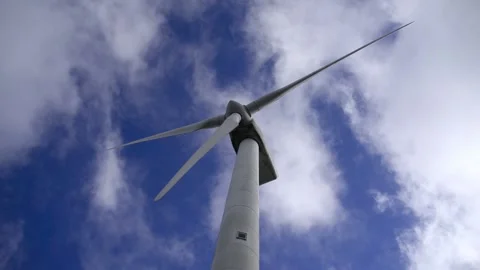 Wind turbine against sky with clouds Stock Footage 136952910
