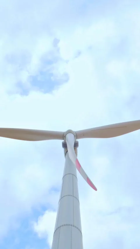 Wind turbine on the background of blue sky in summer with moving clouds Stock Footage 249941495