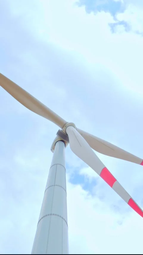 Wind turbine on the background of blue sky in summer with moving clouds Stock Footage 249941718