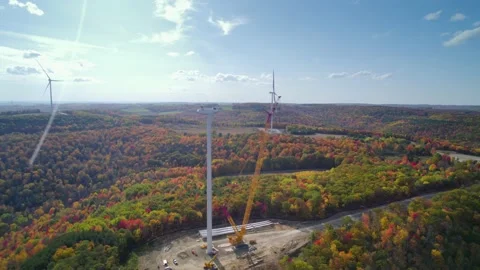 The Wind turbine is being repaired by constructions in Mountain. Stock Footage 226499040