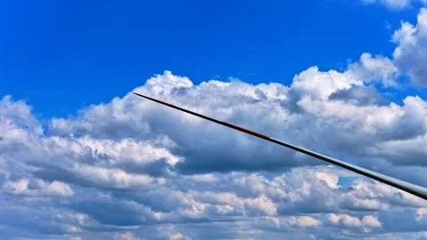 Wind Turbine Blade Against Dramatic Blue Sky with Clouds Fotos Stock