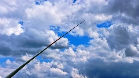 Wind Turbine Blade Against Dramatic Blue Sky with Clouds Fotos Stock