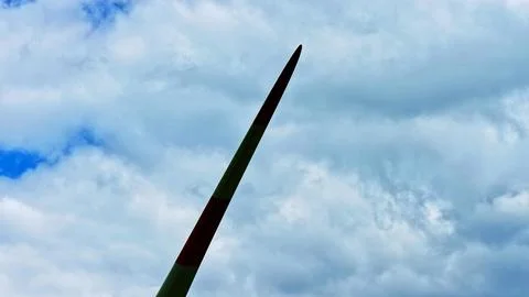 Wind Turbine Blade Against Dramatic Cloudy Blue Sky Fotos Stock
