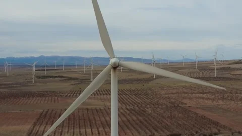 Wind turbine blades rotating generating clean renewable energy Stock Footage 327550079