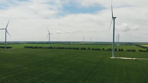 Wind turbine with blue sky and grass field. Stock Footage 159268423