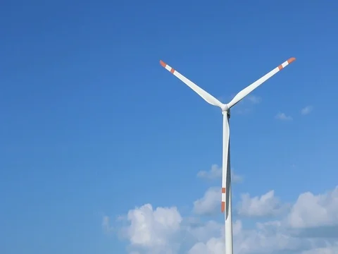 Wind turbine on blue sky background Stock Footage 73720156