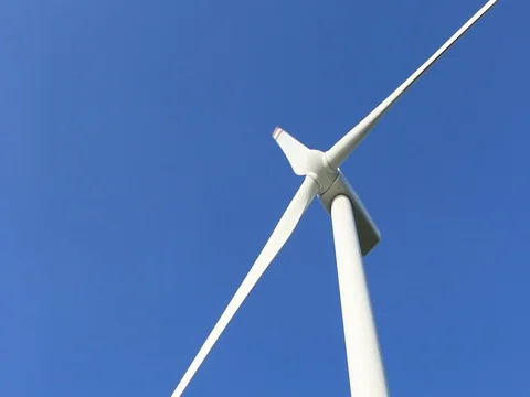 Wind turbine on blue sky background Stock-Footage 73720435
