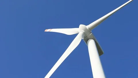 Wind turbine on blue sky background Stock Footage 73720441