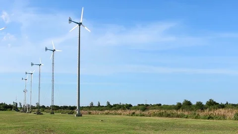 Wind turbine on blue sky background Stock Footage 73722038