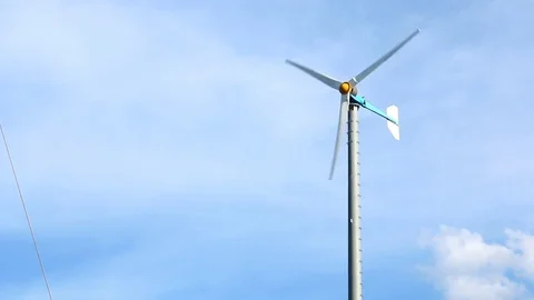 Wind turbine on blue sky background Stock Footage 73722079