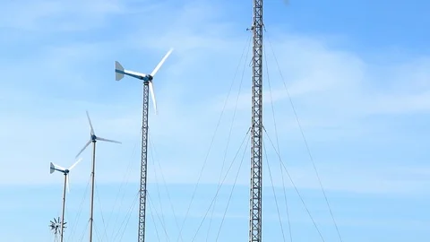 Wind turbine on blue sky background Stock Footage 73722144