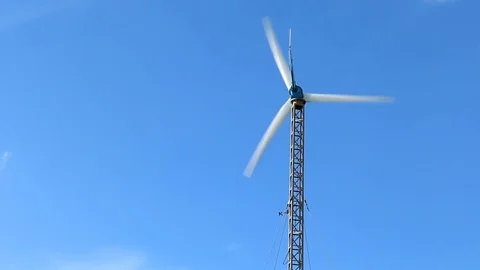 Wind turbine on blue sky background Stock-Footage 73722203
