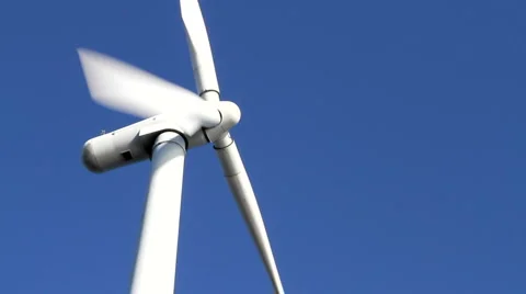 Wind turbine on blue sky Stock Footage