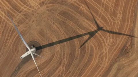 Wind Turbine Casting Long Shadow in Eastern Oregon Stock Footage 346514545