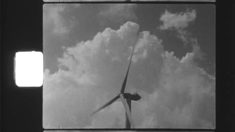 Wind turbine with clouds in the background - Black and White - long shot Video stock 220078432