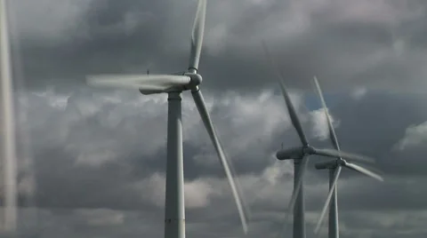Wind turbine clouds time lapse moving fast with slow turbines Видео 58359651